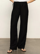 black track pant with a cream stripe down the sides