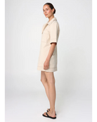 beige mini dress with pockets on the chest and a collar
