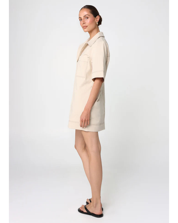 beige mini dress with pockets on the chest and a collar