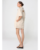 beige mini dress with pockets on the chest and a collar