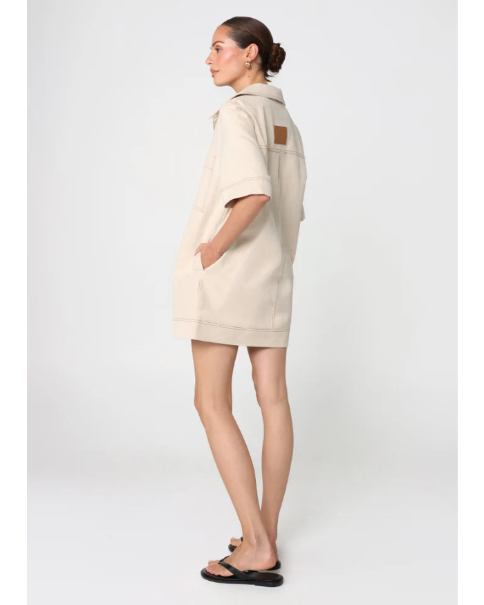 beige mini dress with pockets on the chest and a collar