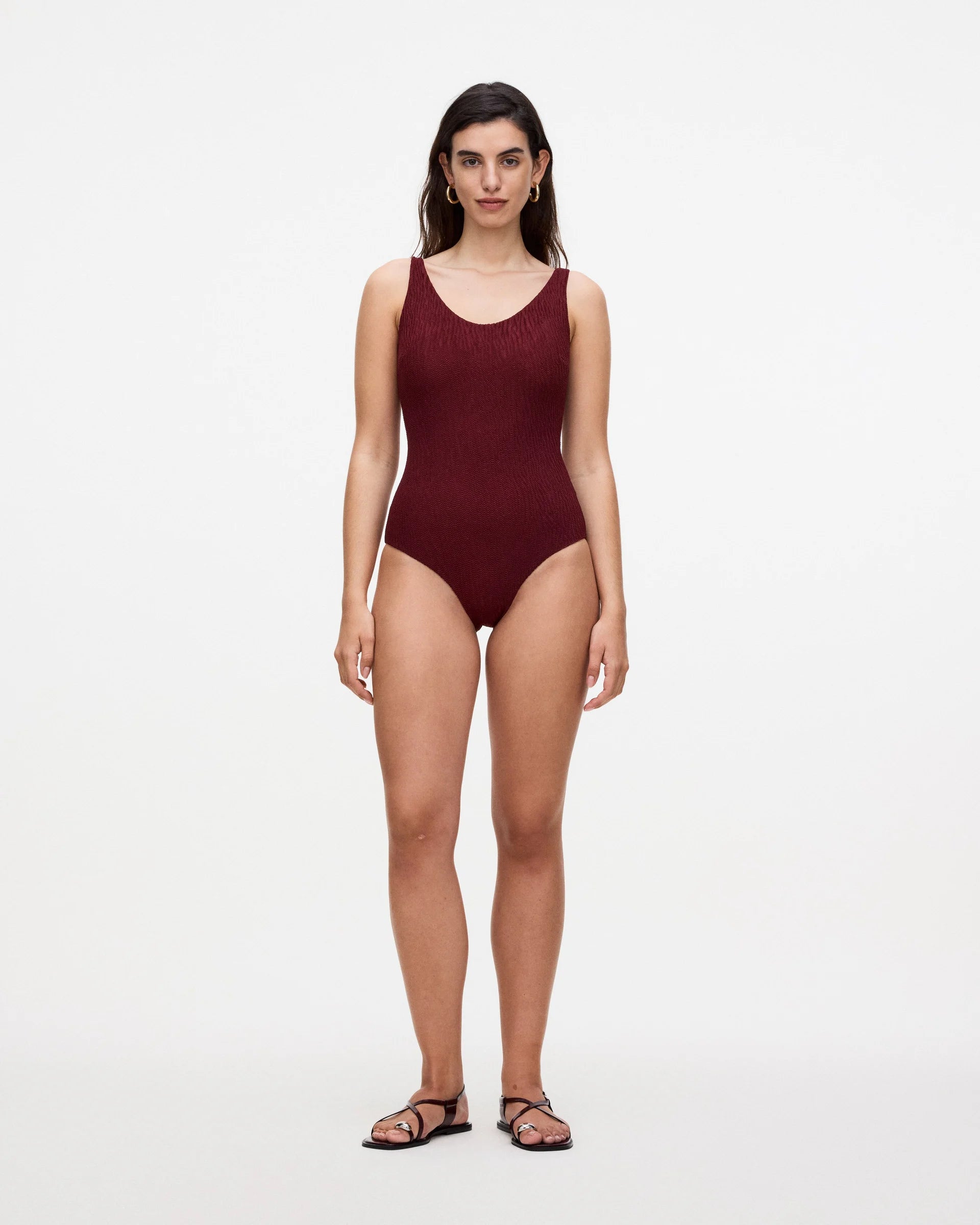 a red one piece bathing suit that has a ribbed knitted texture