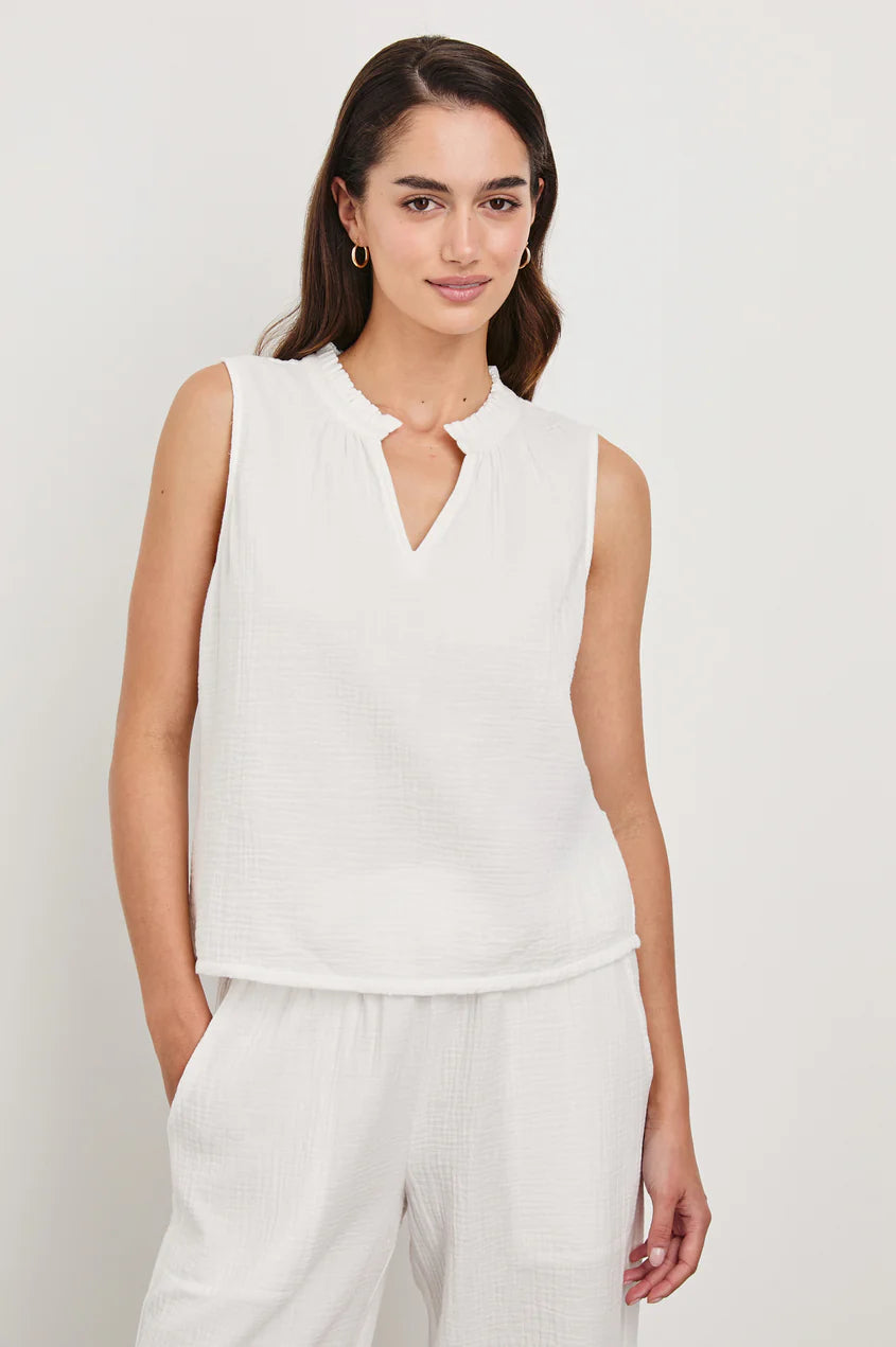 loose fitting white tank top with a v cut out at the top