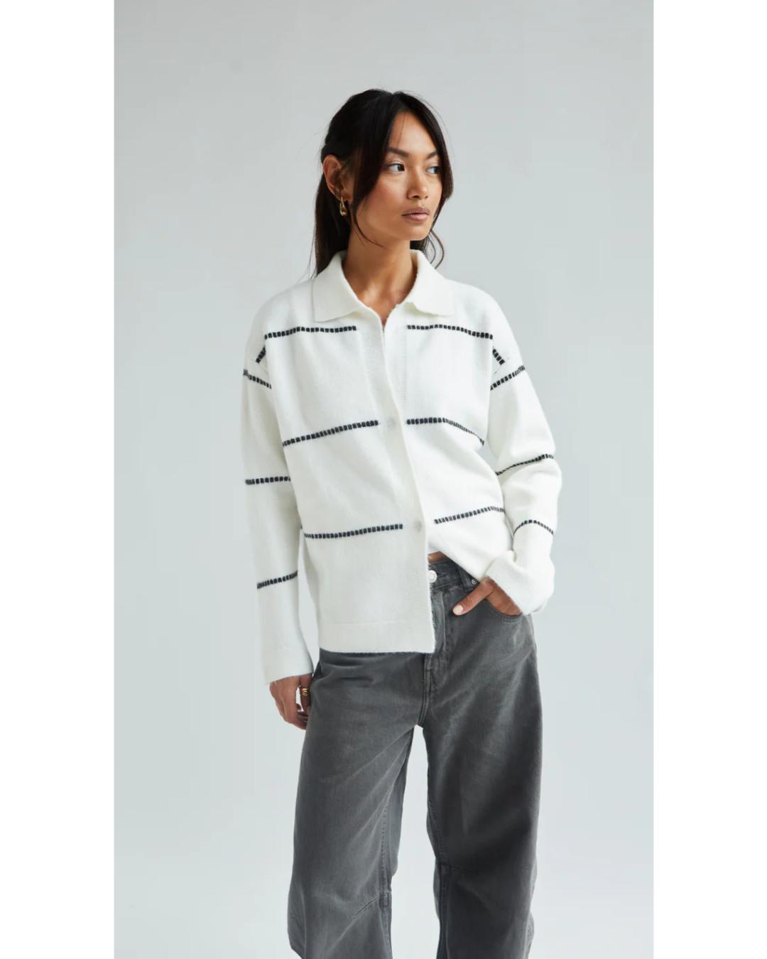 white cardigan with a collar and with black stripes