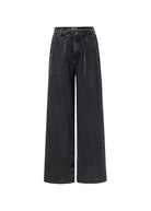 Black wide-leg jeans on a white background