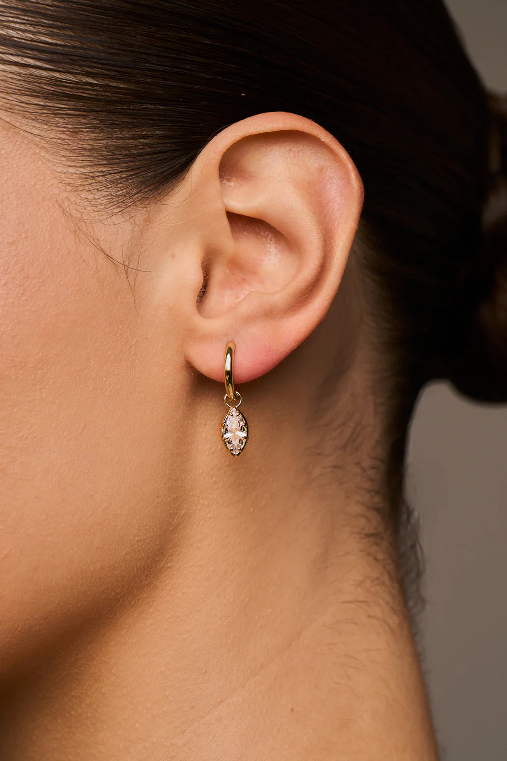 gold huggie earring with drop marquise diamond