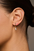 gold huggie earring with drop marquise diamond