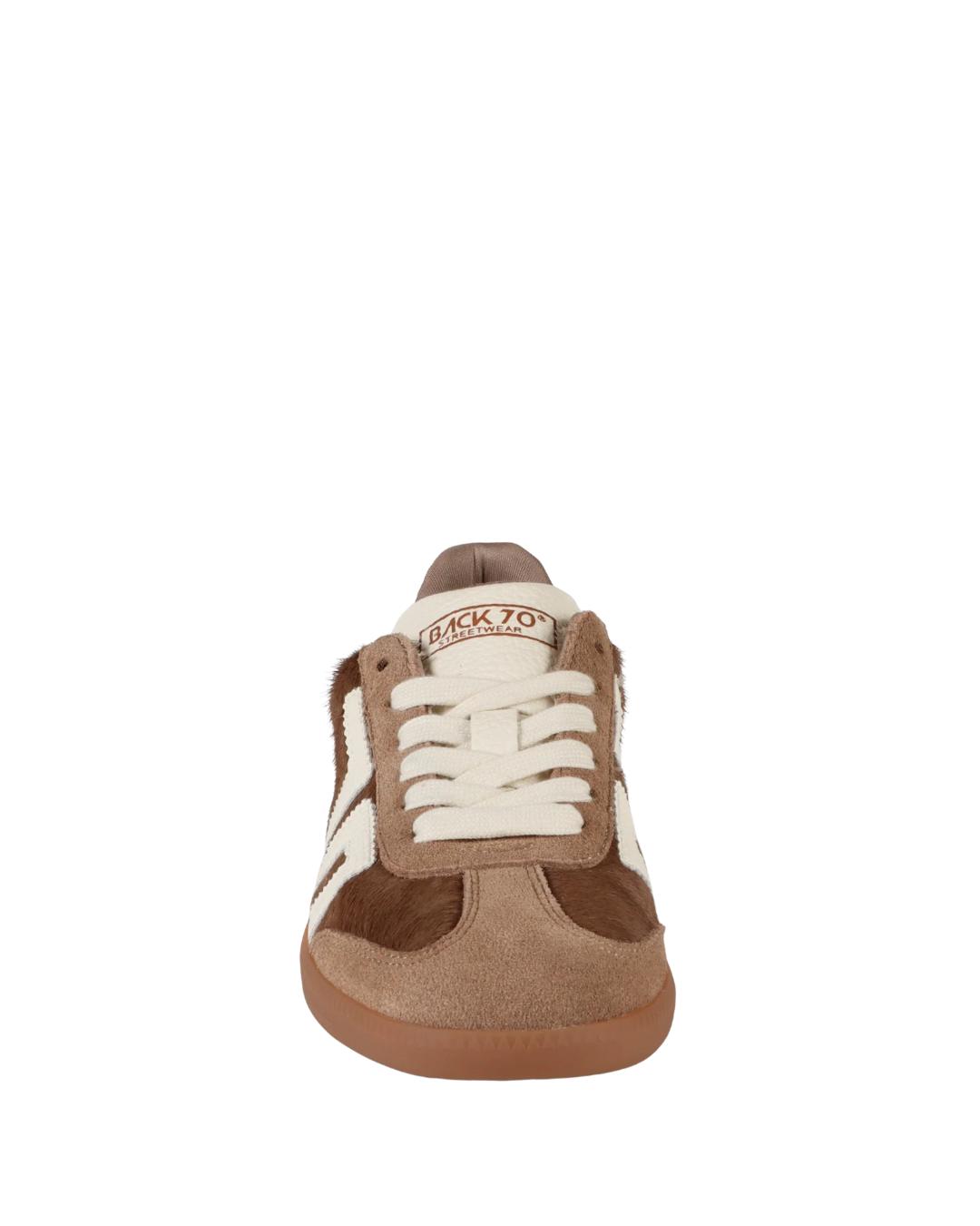 taupe sneaker with 70 on it in white