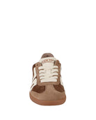 taupe sneaker with 70 on it in white