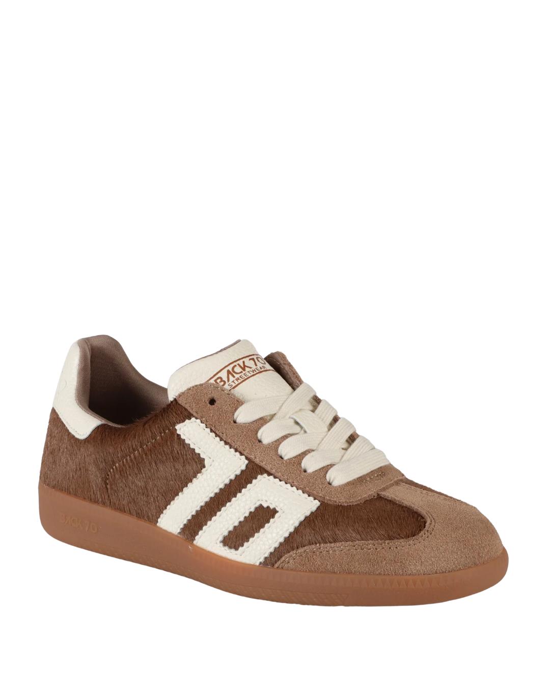 taupe sneaker with 70 on it in white