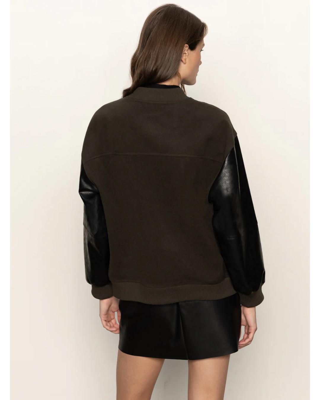 varsity jacket with black faux leather sleeves and a deep green front and back
