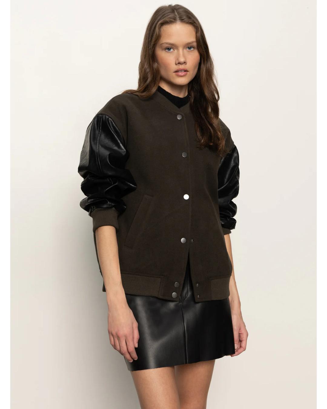 varsity jacket with black faux leather sleeves and a deep green front and back