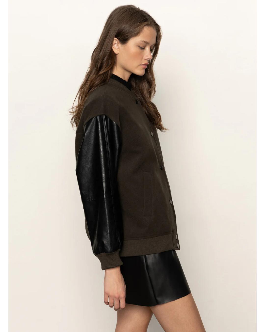 varsity jacket with black faux leather sleeves and a deep green front and back