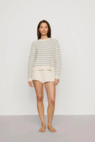 cream sweater with a light blue stripe