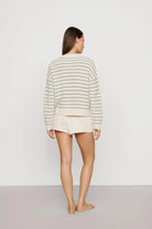 cream sweater with a light blue stripe