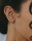 gold stud earrings with stone in the middle