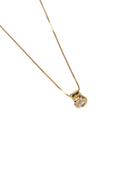 gold necklace with a stone pendant 