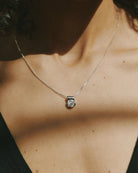 silver necklace with gem pendant 