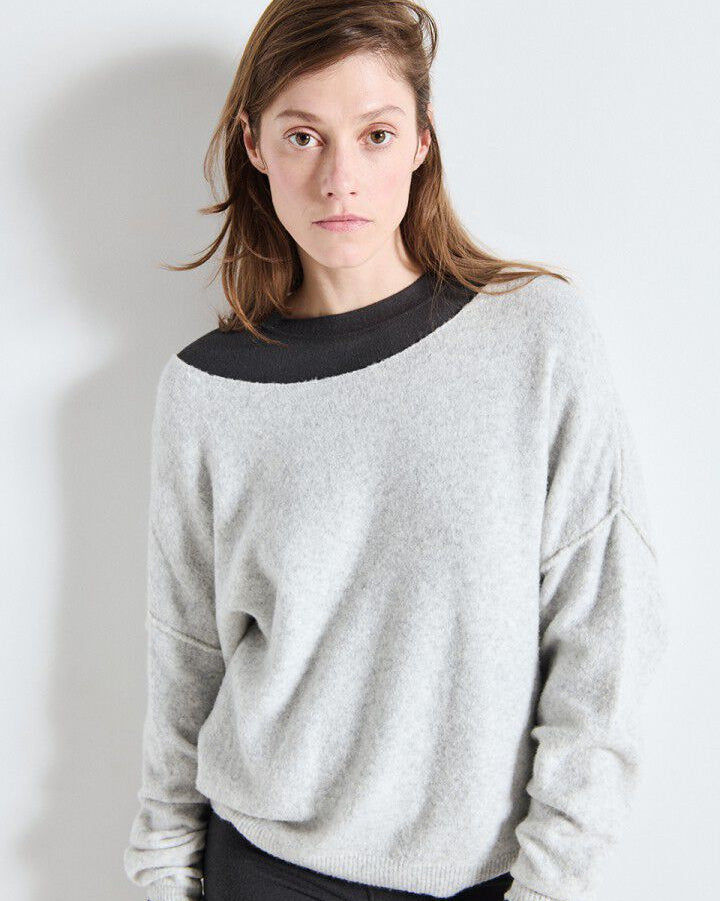 grey nit sweater that is off the shoulders