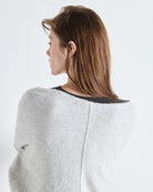 grey nit sweater that is off the shoulders