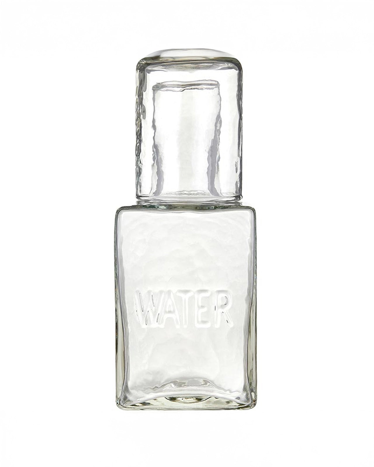 a picture of a glass water decanter with a cup that acts as a lid