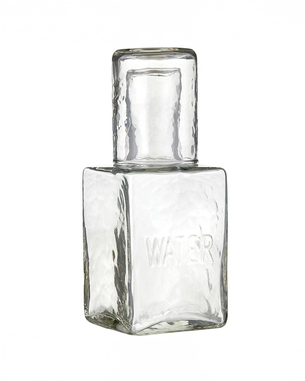 a picture of a glass water decanter with a cup that acts as a lid