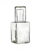 a picture of a glass water decanter with a cup that acts as a lid