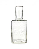 a picture of a glass water decanter with a cup that acts as a lid