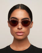 oval brown sunglasses with thin frame