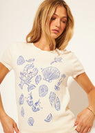 cream t-shirt with blue outlines of ocean finds