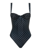 black onepiece swimsuit with cream polka dots