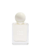 White perfume bottle with a spherical cap on a white background
