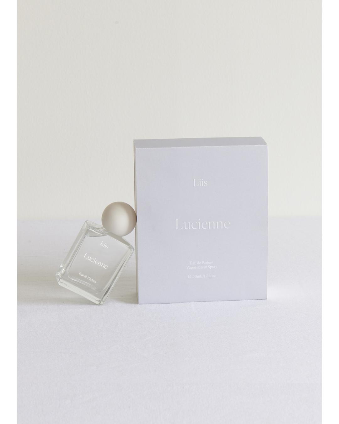 Lucienne perfume bottle and packaging on a white background