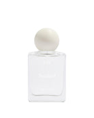 White perfume bottle with a round cap on a white background