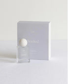 Perfume bottle with packaging labeled 'Studled' on a white background