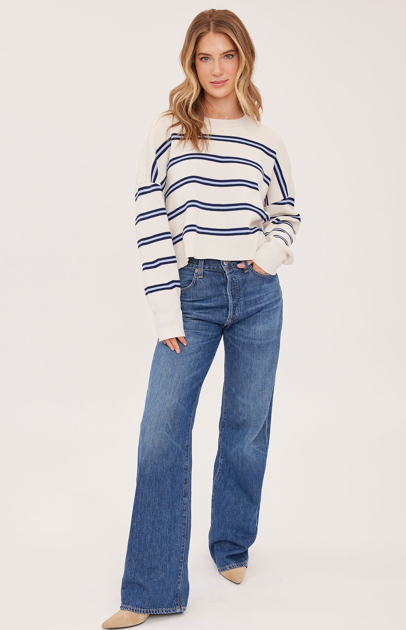 cream sweater with a dark and light blue stripe