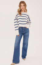 cream sweater with a dark and light blue stripe