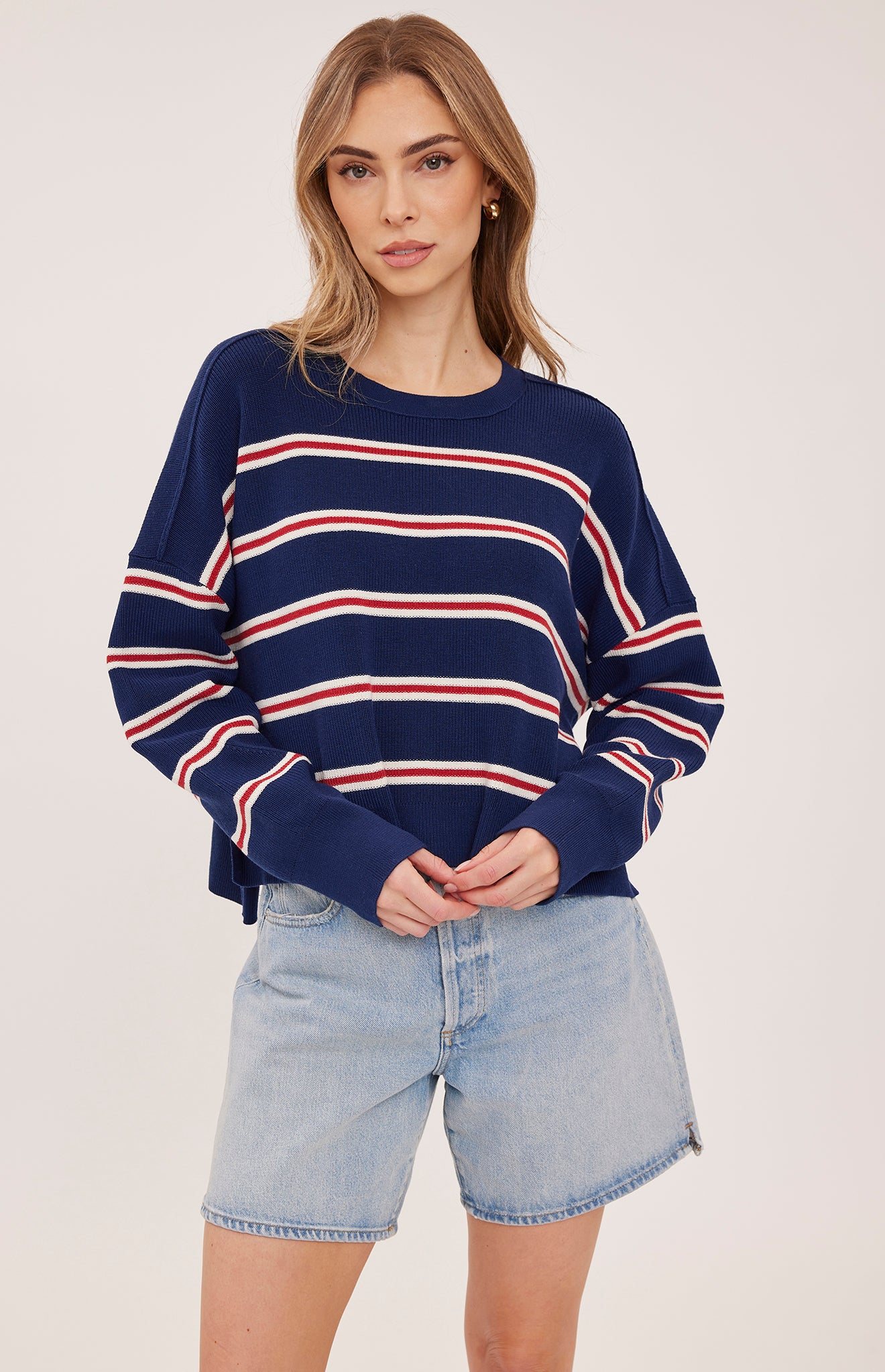 navy sweater with red and white stripes