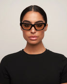 cat eye statement sunglasses with black frame and brown lenses 