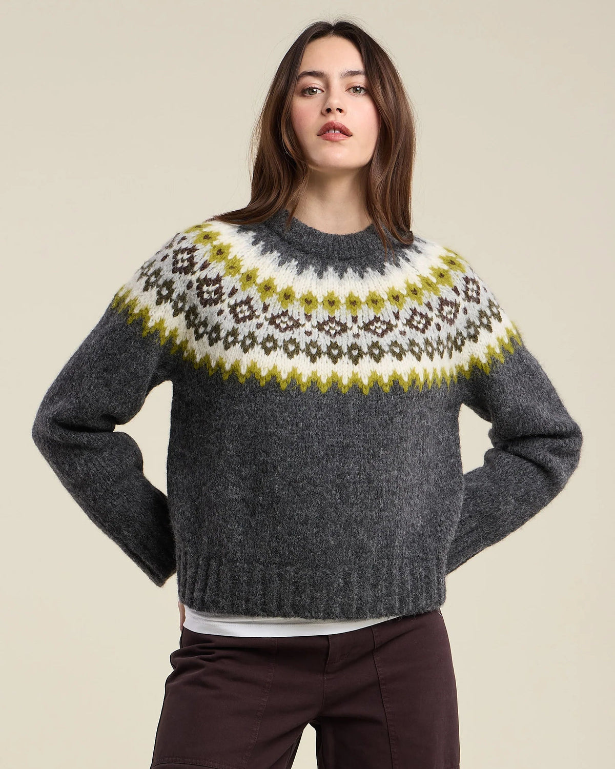 grey knit sweater with green and grey fair isle design on the top