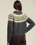 grey knit sweater with green and grey fair isle design on the top