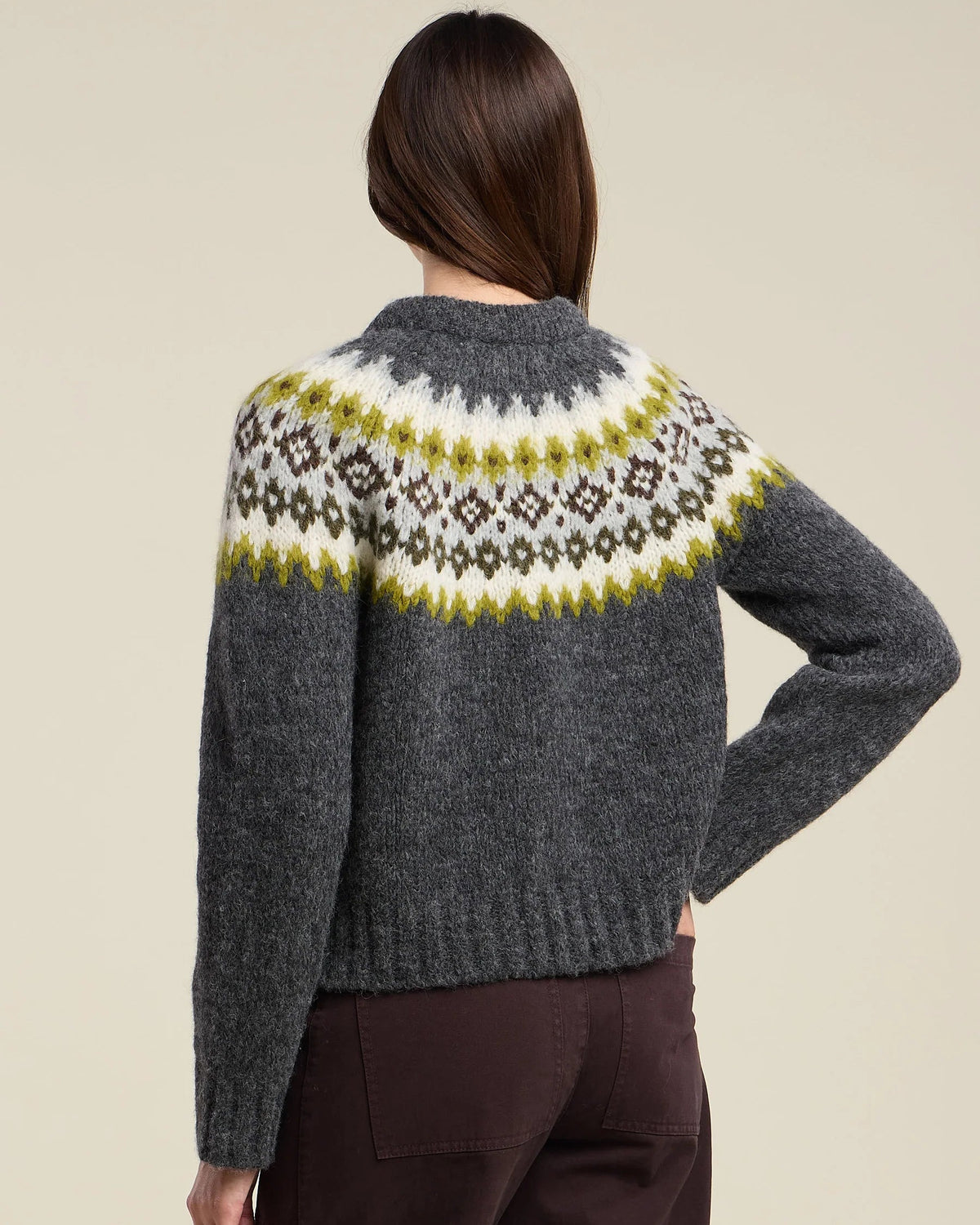 grey knit sweater with green and grey fair isle design on the top