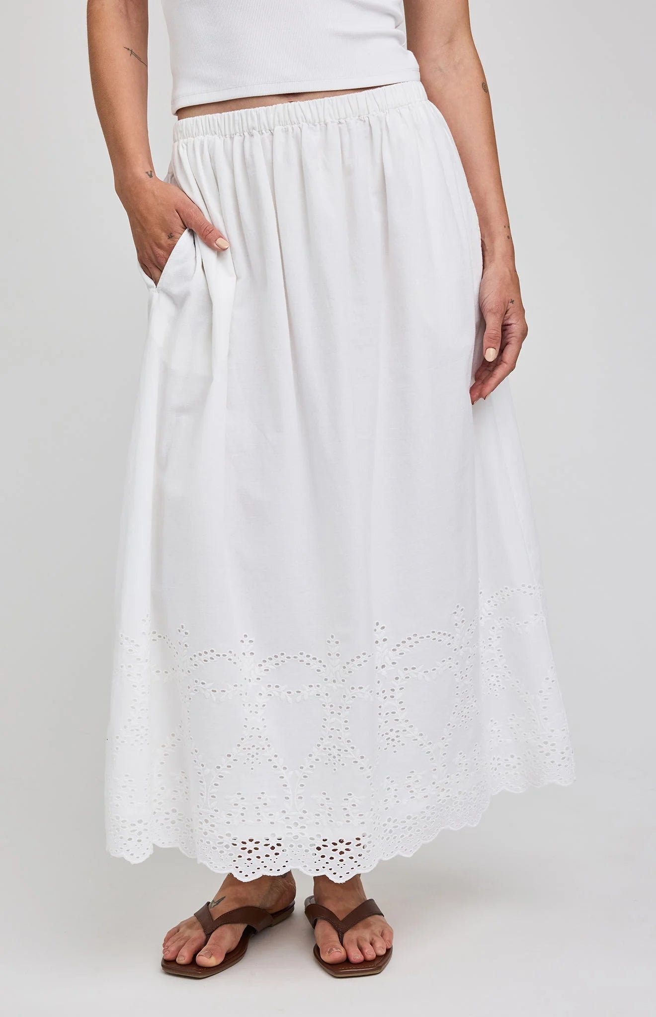 midi white skirt with eyelet patterns on the bottoms