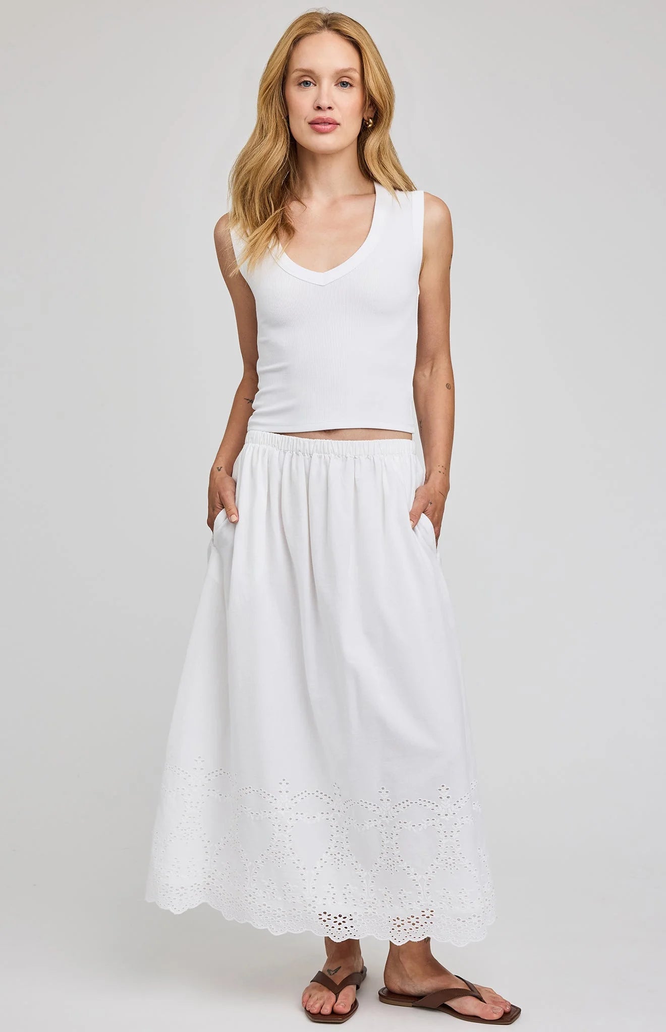 midi white skirt with eyelet patterns on the bottoms