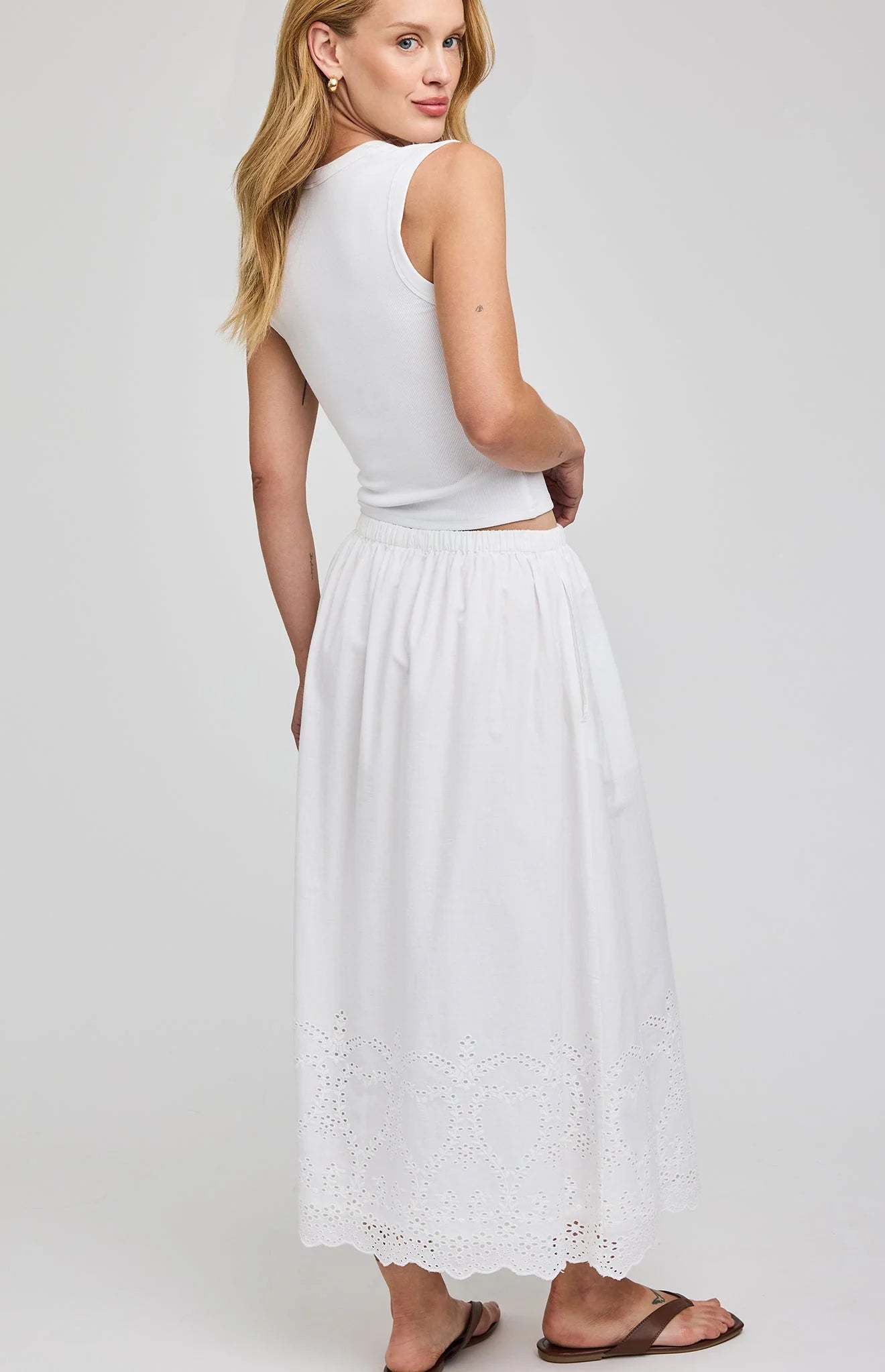 midi white skirt with eyelet patterns on the bottoms