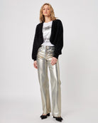 Woman wearing a black fluffy cardigan shrug