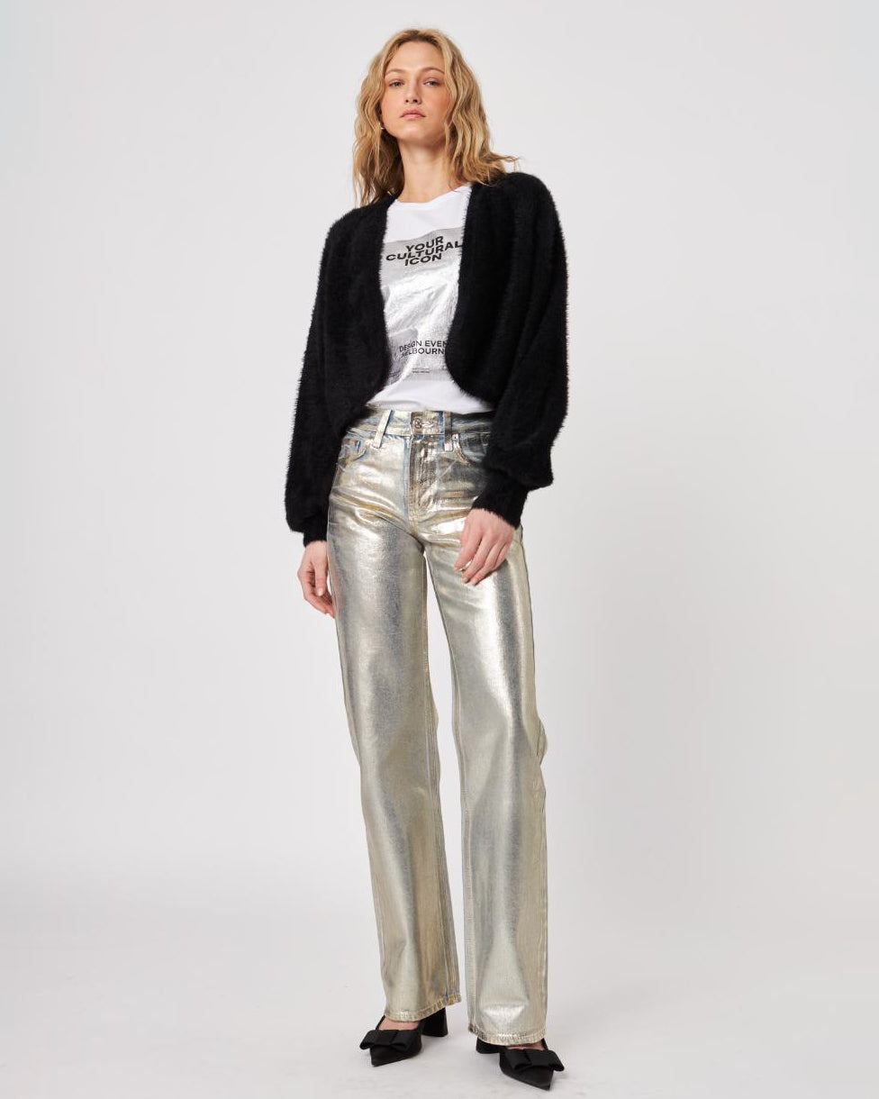 Woman wearing a black fluffy cardigan shrug