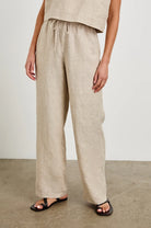a wide leg pant in a tan colour