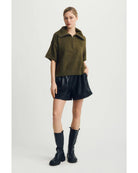 green short sleeve sweater with a half zip