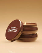 candle in a brown tin